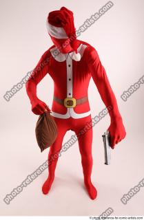 26 2019 01 JOEL ADAMSON CHRISTMASVILLAIN WITH GUN AND BAG